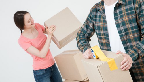 Professional movers loading furniture into a moving truck in Manvan