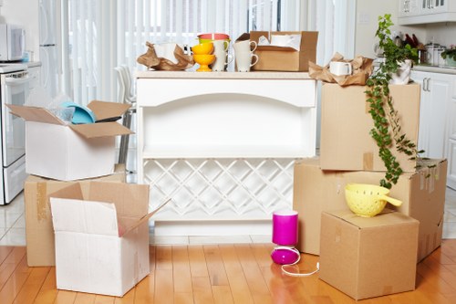 Packed boxes and furniture ready for flat removals in Manvan