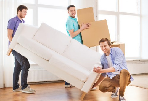 Professional movers loading furniture for a Manvan relocation