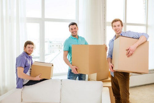 Team packing fragile items during a Manvan moving service
