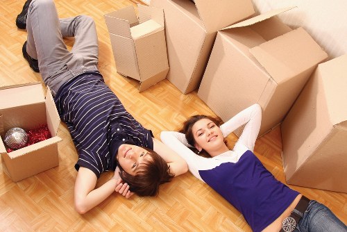 Professional movers loading business assets for relocation