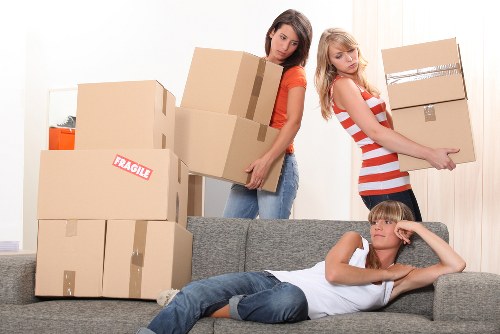 Local removal team loading furniture for a Manvan relocation